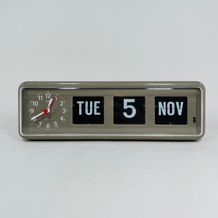 Retro grey analog flip clock with clock face and vintage mechanical flip date, mid-century modern desk or wall clock