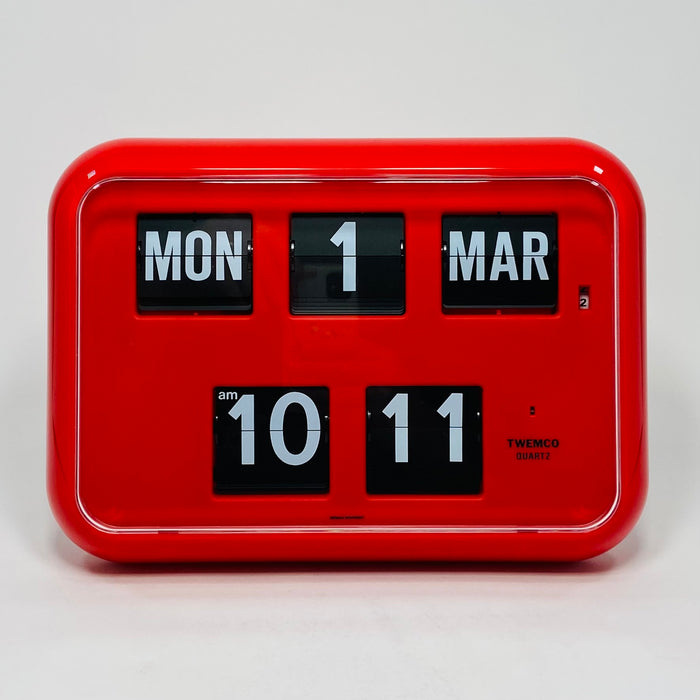 Retro red analog flip clock with perpetual calendar, vintage mechanical flip display, mid-century modern desk or wall clock