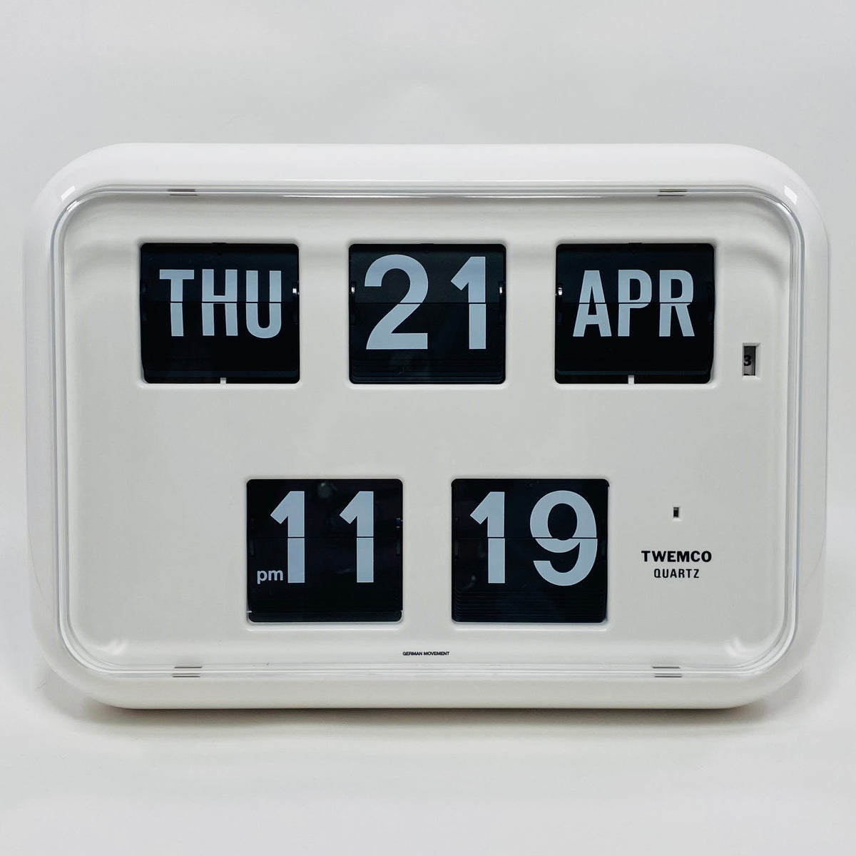Retro white analog flip clock with perpetual calendar, vintage mechanical flip display, mid-century modern desk or wall clock