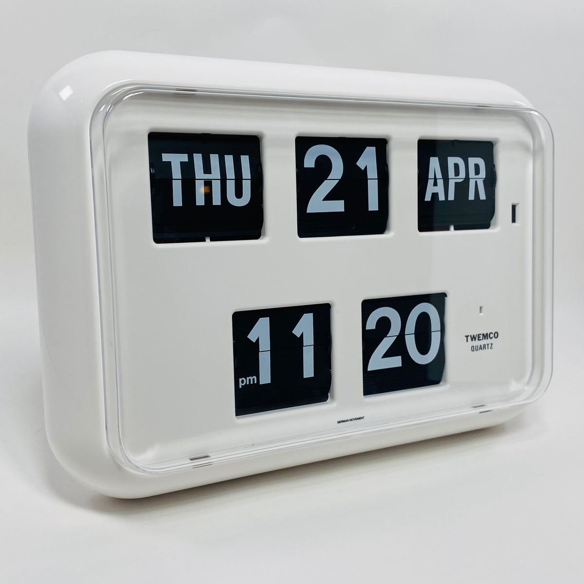 Retro white analog flip clock with perpetual calendar, vintage mechanical flip display, mid-century modern desk or wall clock