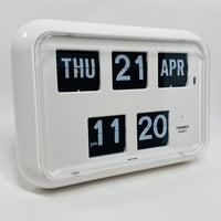 Retro white analog flip clock with perpetual calendar, vintage mechanical flip display, mid-century modern desk or wall clock
