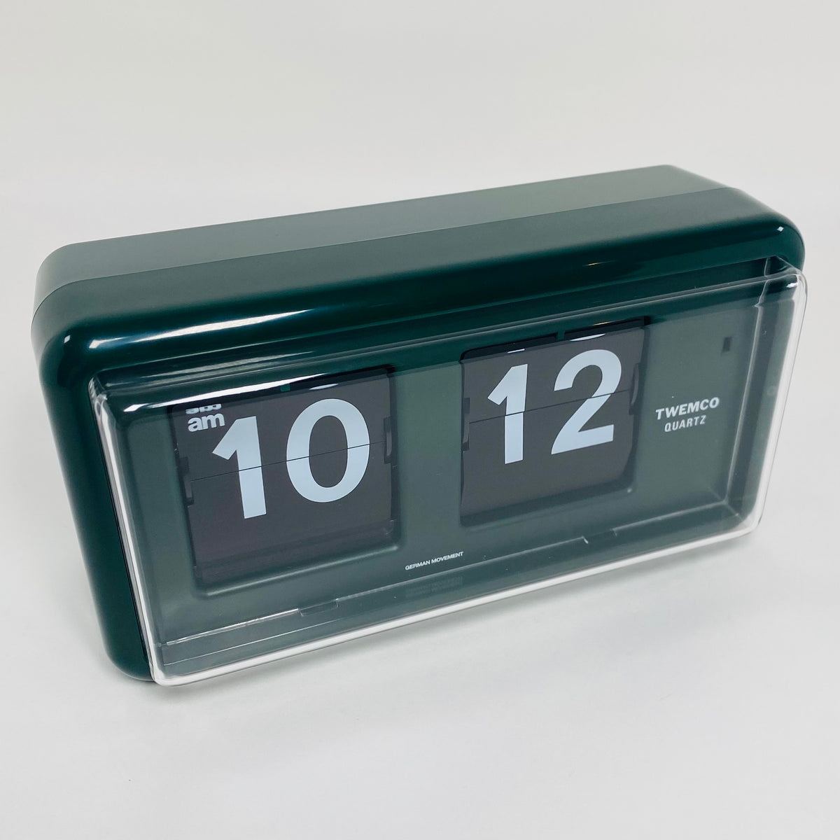 Retro green analog flip clock, vintage mechanical flip display, mid-century modern desk or wall clock