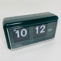 Retro green analog flip clock, vintage mechanical flip display, mid-century modern desk or wall clock