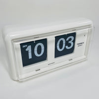 Retro white analog flip clock, vintage mechanical flip display, mid-century modern desk or wall clock