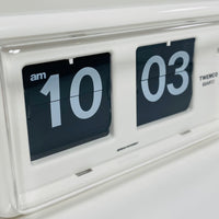 Retro white analog flip clock, vintage mechanical flip display, mid-century modern desk or wall clock